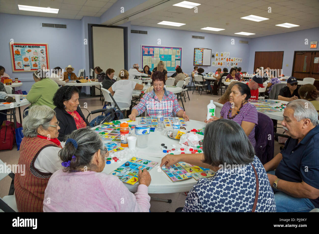 Houston, Texas - Senior citizens play board games at Wesley Community Center. Stock Photo