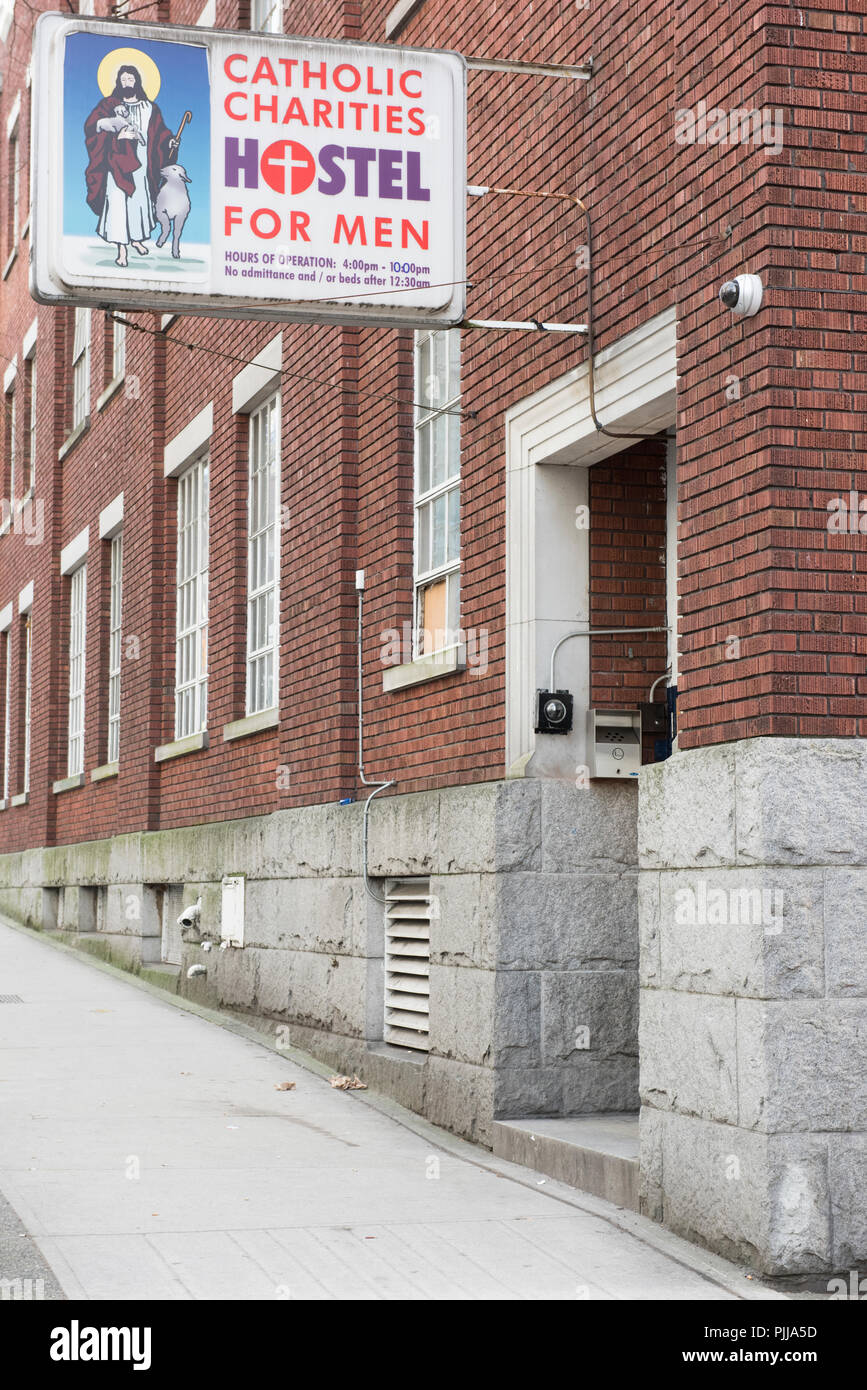Old Brick Building, housing hostel for men, in downtown Vancouver City. Stock Photo