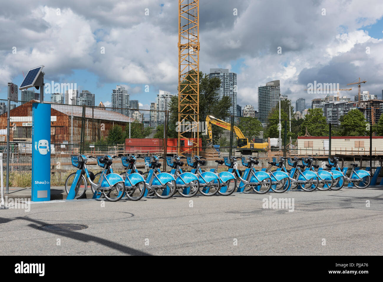 City of Vancouver newly established public bike rentals situated in front of a new construction site. Stock Photo