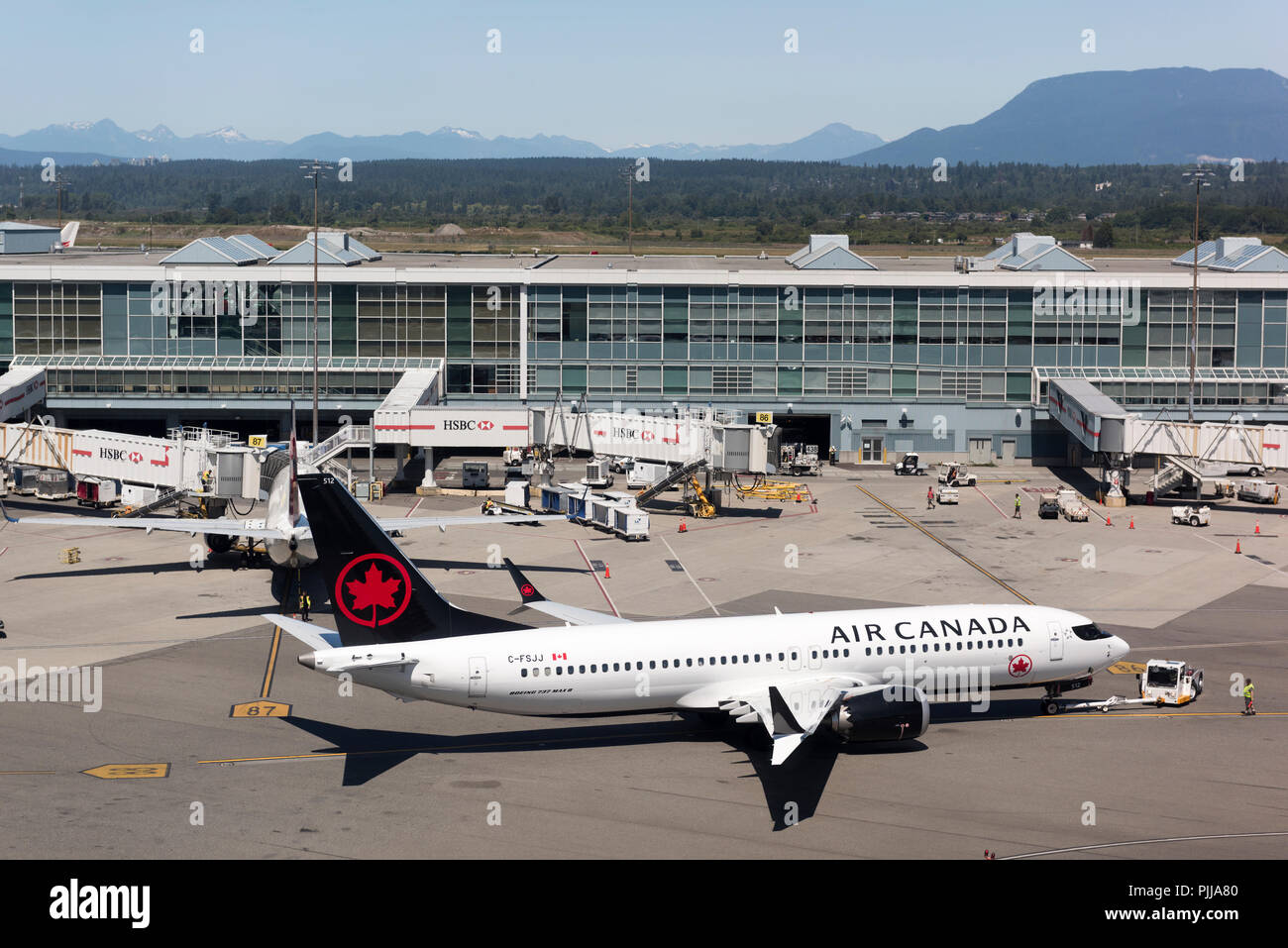 Boeing 737 Max 8 in tow at the Vancouver International Airport Terminal. Stock Photo