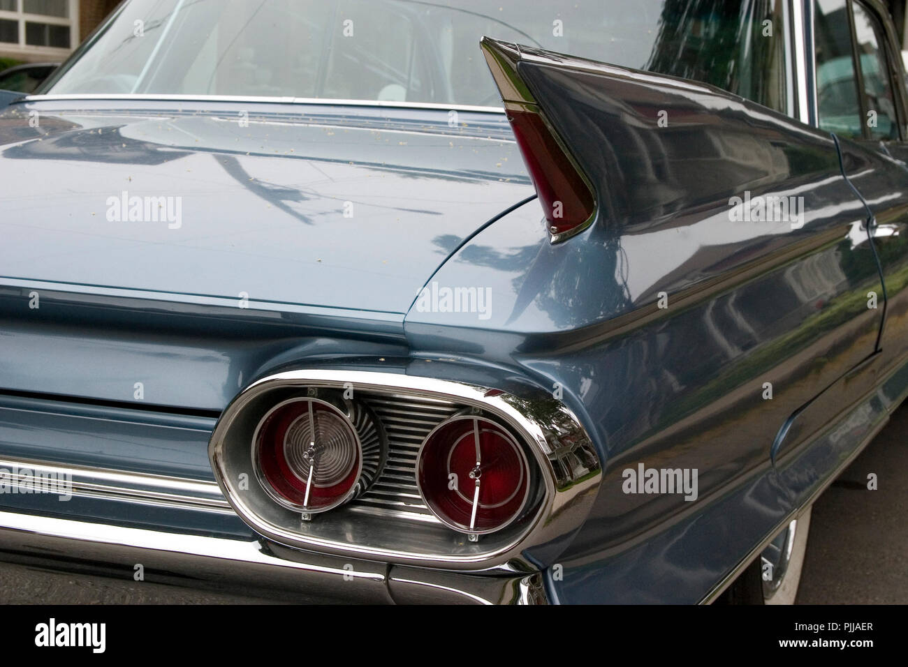 Back end of a classic car with tail fin and lights. Beautiful luxury