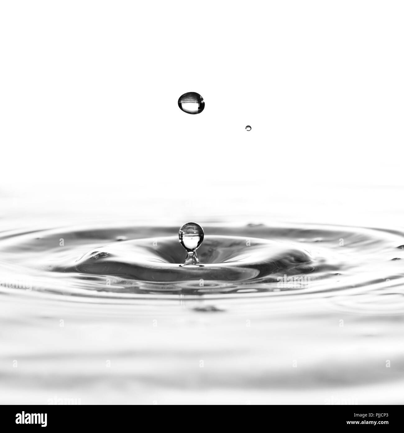 A water drop black and white background Stock Photo - Alamy