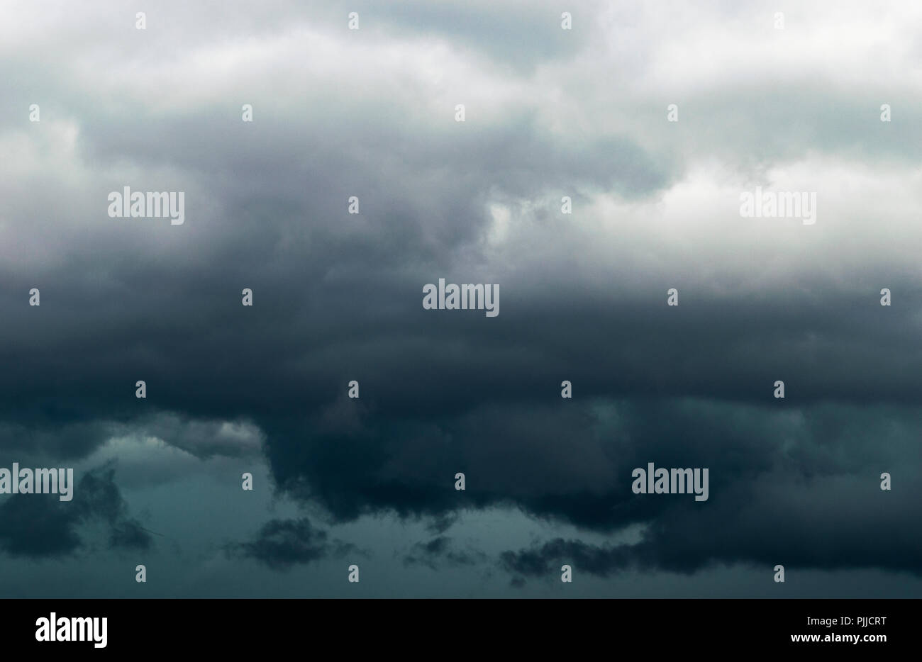 The big powerful storm clouds before a thunder storm. Dark storm clouds. Stormy clouds background Stock Photo