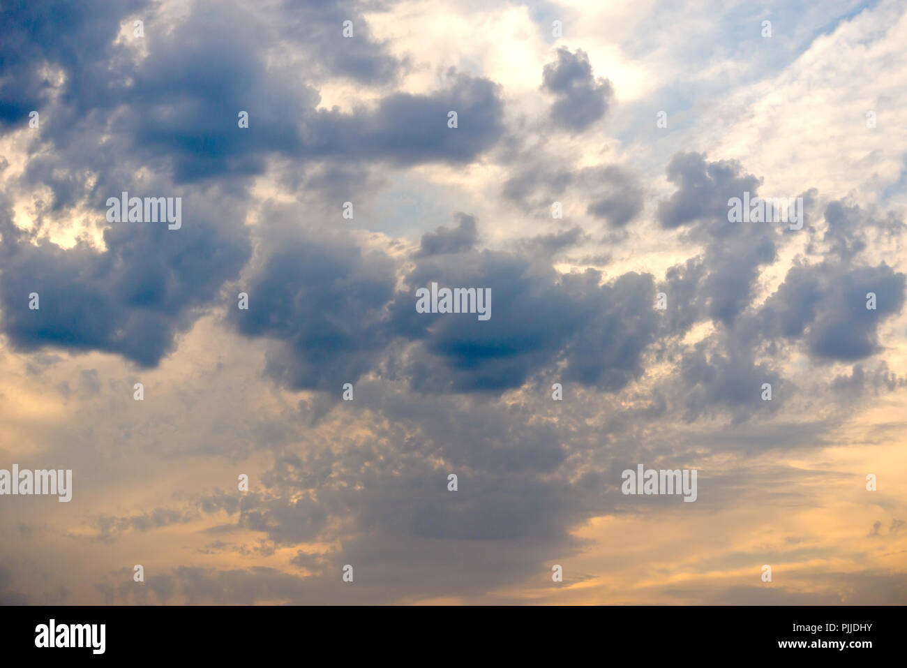 Sunset sky with blue clouds Stock Photo - Alamy