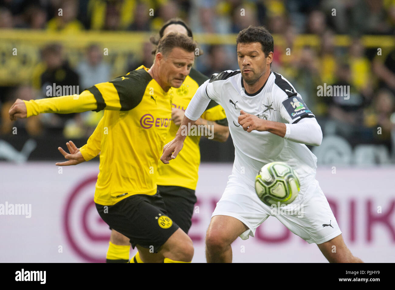 Dortmund, Germany. 07th Sep, 2018. Soccer: Farewell game for Roman Weidenfeller. Christian Woerns from the 'BVB Allstars' (L) and Michael Ballack from 'Roman and Friends' vie for the ball. Credit: Bernd Thissen/dpa/Alamy Live News Stock Photo
