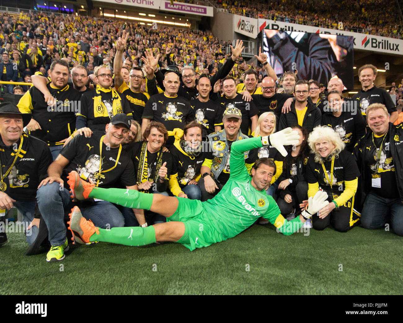 Dortmund, Germany. 07th Sep, 2018. Soccer: Farewell game by Roman Weidenfeller. Roman Weidenfeller poses in the halftime with the flag bearers of the BVB fans. Credit: Bernd Thissen/dpa/Alamy Live News Stock Photo
