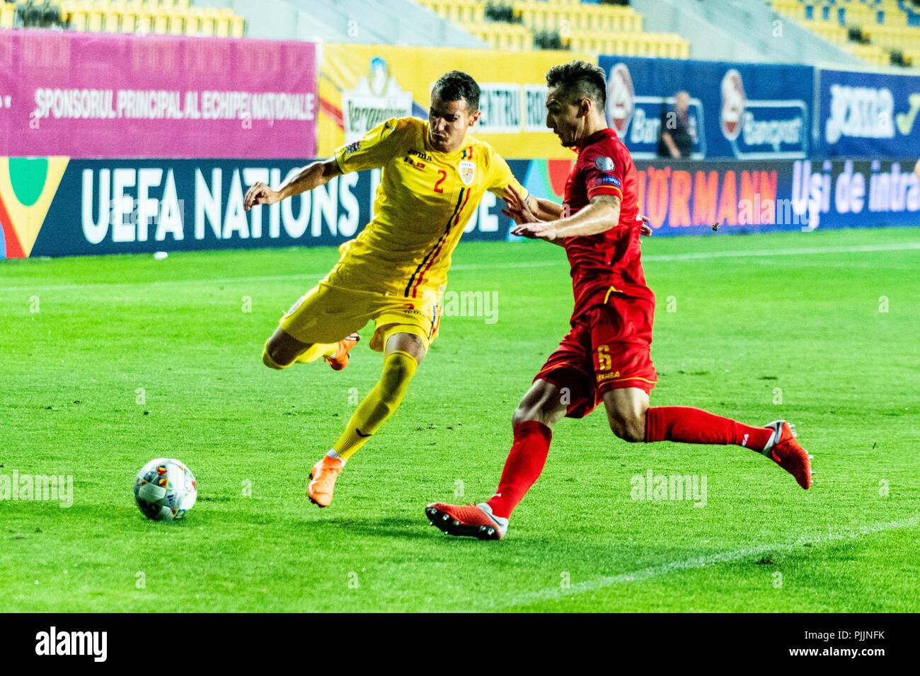 Ploiesti, Romania. 7th September 2018. Romario Benzar #2 (Romania) Zarko Tomasevic #6 (Montenegro) during the Soccer, UEFA Nations League 2019, Final Tournament, game between the national teams of Romania (ROU) and Montenegro (