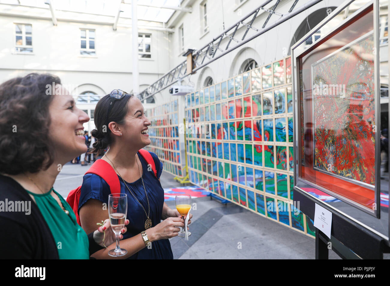 Brussels, Belgium. 7th Sep, 2018. People watch an exhibition entitled 'Odi, La Scene' by Chinese artist Song Dong in Brussels, Belgium, Sept. 7, 2018. Presenting more than 20 paintings and installations, the exhibition in Brussels on Friday kicked off the month-long tour of the Odi exhibition in Belgium, France and Luxembourg. Credit: Zheng Huansong/Xinhua/Alamy Live News Stock Photo