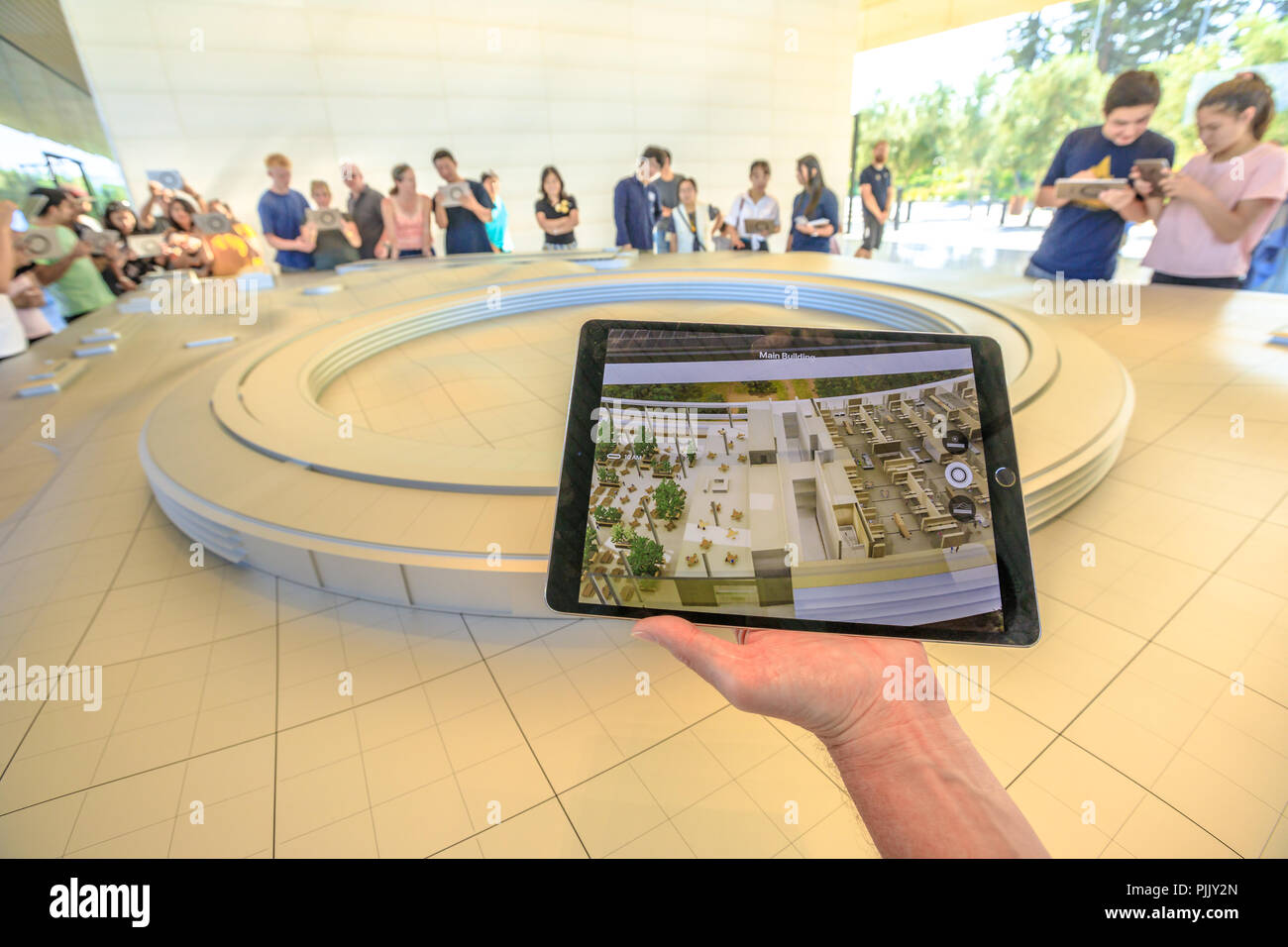 Cupertino, CA, United States - August 12, 2018: 3d map demonstration with iPad view of the new Apple Headquarters at Apple Park Visitor Center in Tantau Avenue of Cupertino, Silicon Valley,California. Stock Photo