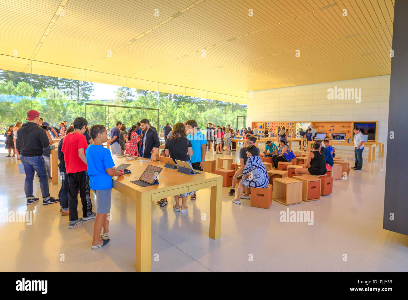 Cupertino, CA, United States - August 12, 2018: interior with many customers in the new Apple store and Headquarters of Apple Park Visitor Center, Tantau Avenue, Cupertino, Silicon Valley, California Stock Photo