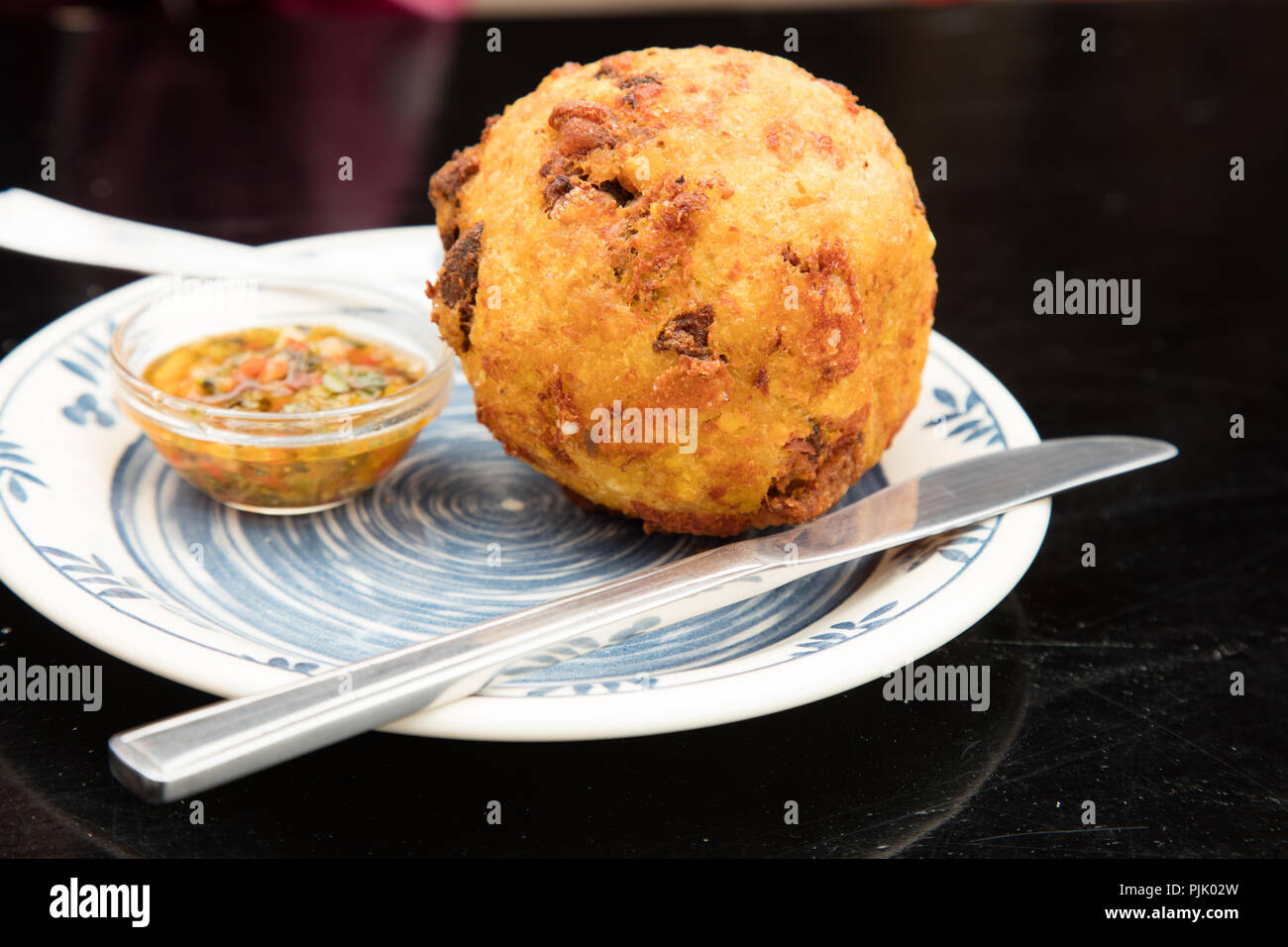 Bolon de Verde, a classic ecuadorian dish comprised principally of a fried ball of crushed green plantains, with various other ingredients (e.g. pork) Stock Photo