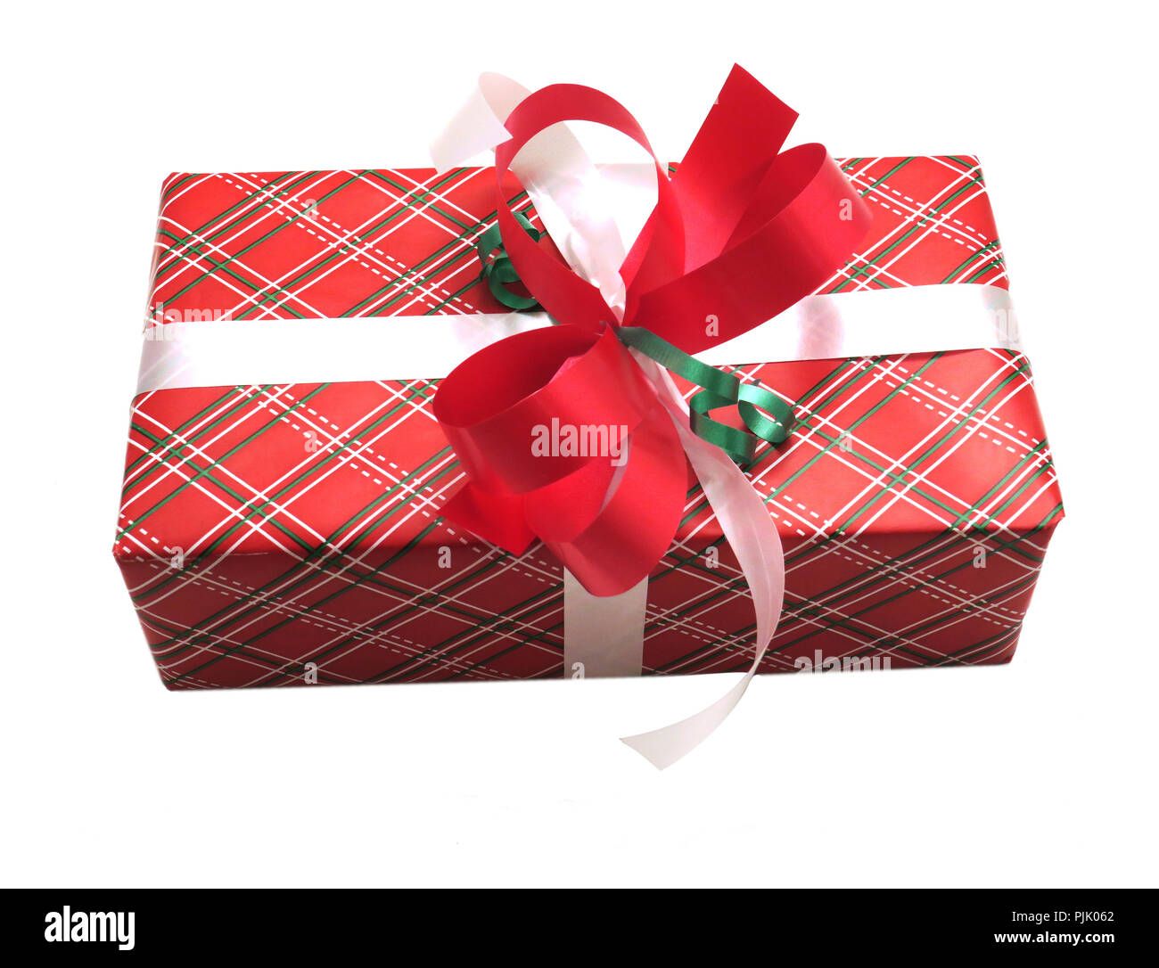 Christmas present wrap with a decorative red and white bow Stock Photo