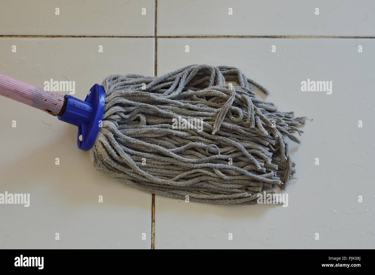 mop the tile floor in home Stock Photo Alamy