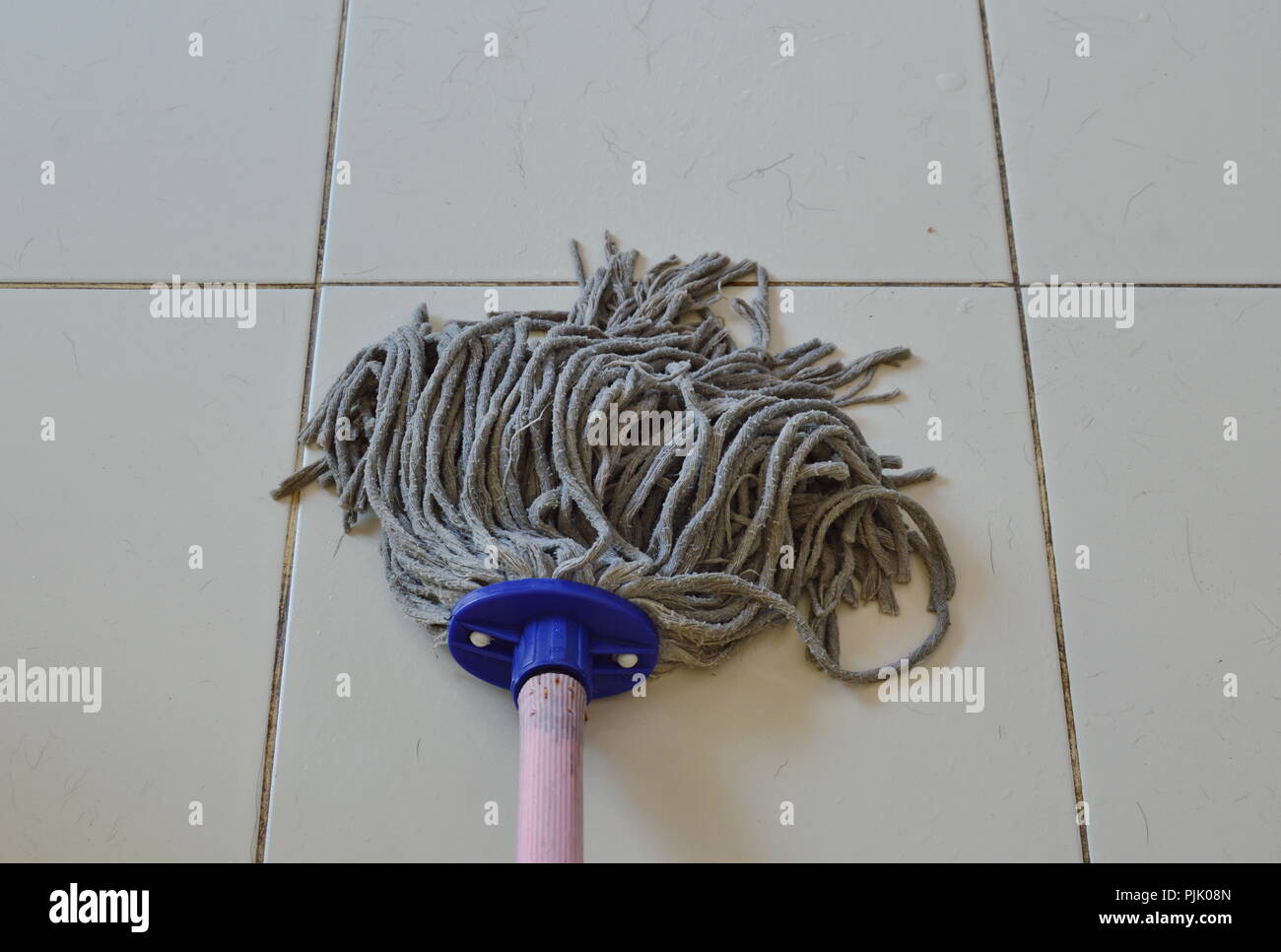 mop the tile floor in home Stock Photo Alamy