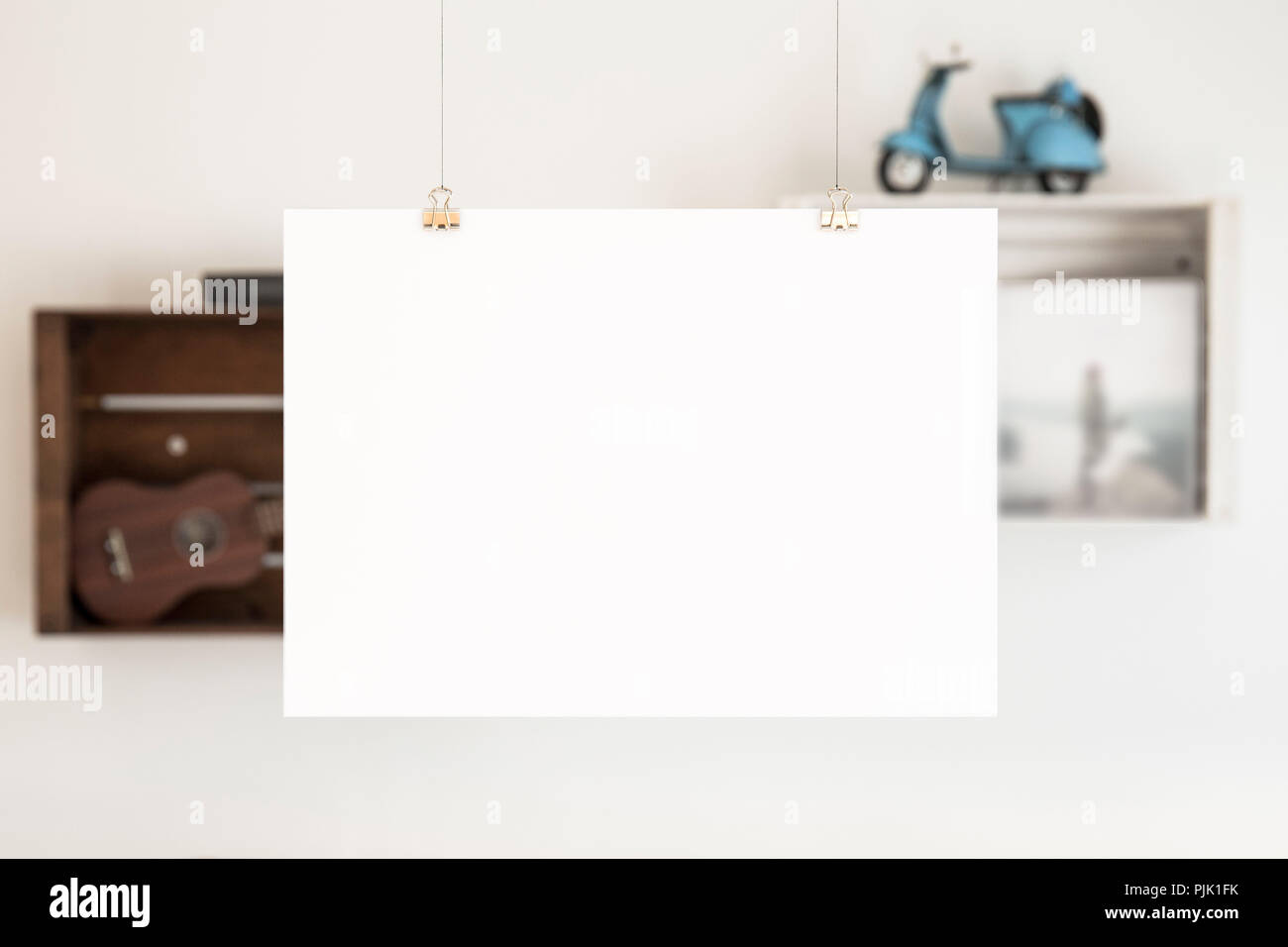 A blank sheet with free text space, suspended from the ceiling Stock Photo