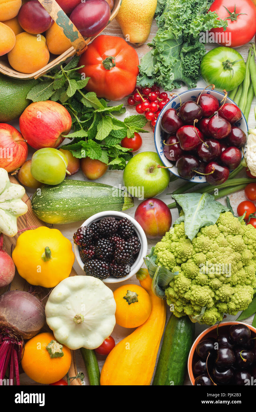 Healthy summer fruits vegetables berries background, cherries peaches