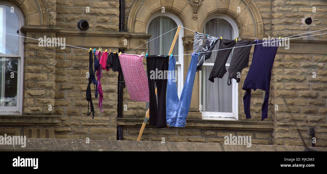 Clothes hanging out to dry on washing line in Saltaire Yorkshire,uk Stock Photo