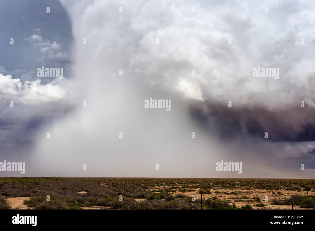 Microburst of hail and rain falling from a supercell thunderstorm cloud in Arizona Stock Photo