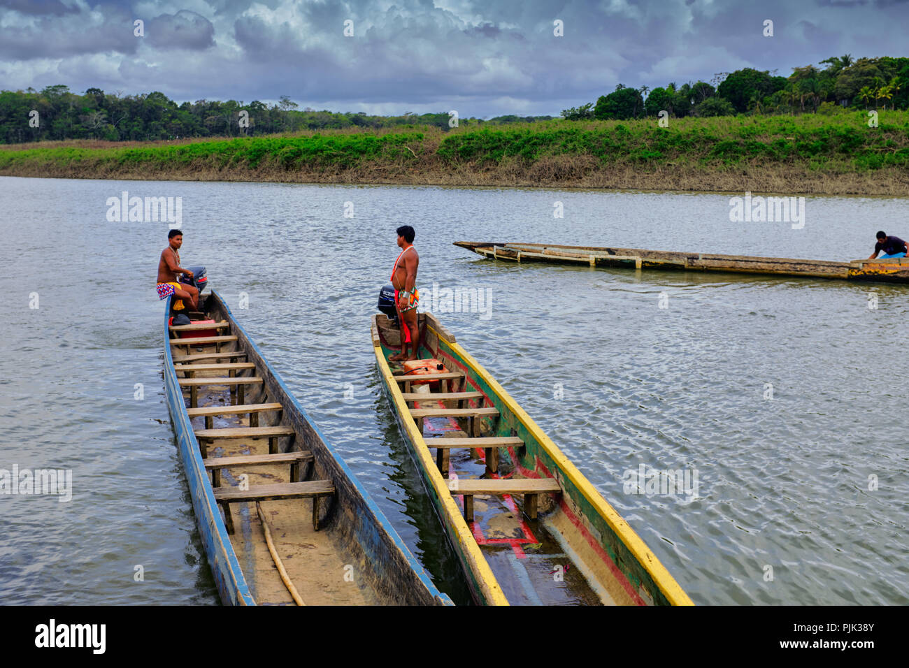 Native people in dugout canoes, along the Rio Chagres river, Chagres National Park, Panama Stock Photo