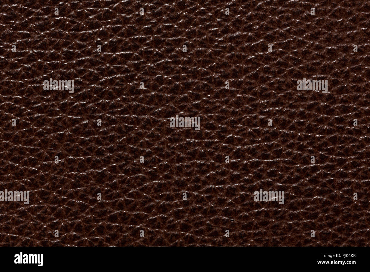 Refined leather background in stylish brown tone. Stock Photo