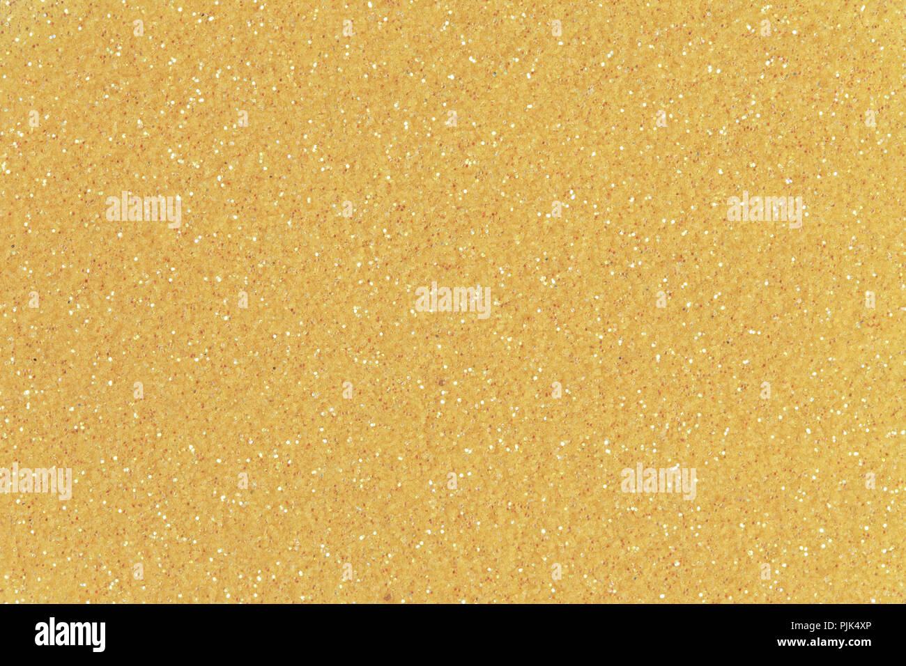 Abstract light orange glitter background. Low contrast photo. High