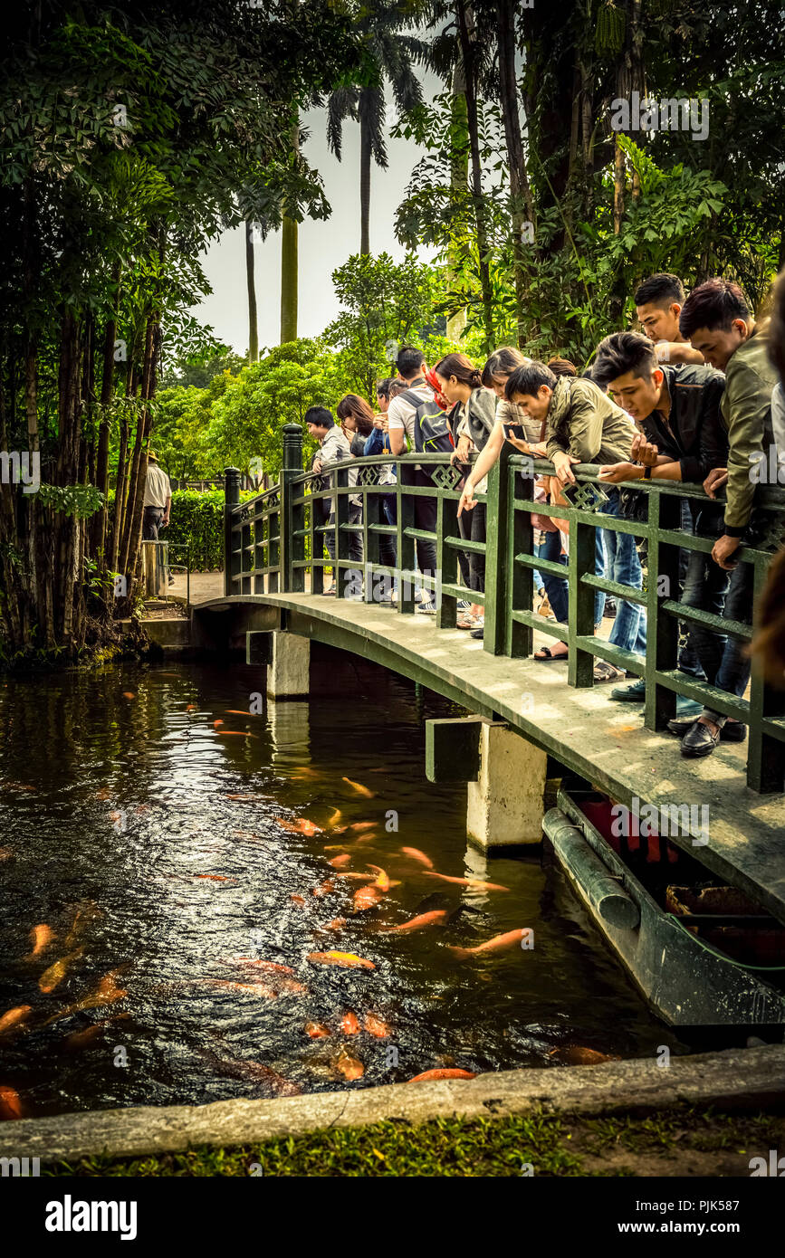 Palace, Ho Chi Minh Mausoleum, Hanoi, Vietnam, Southeast Asia, Asia, tourists on bridge over fishpond, Stock Photo