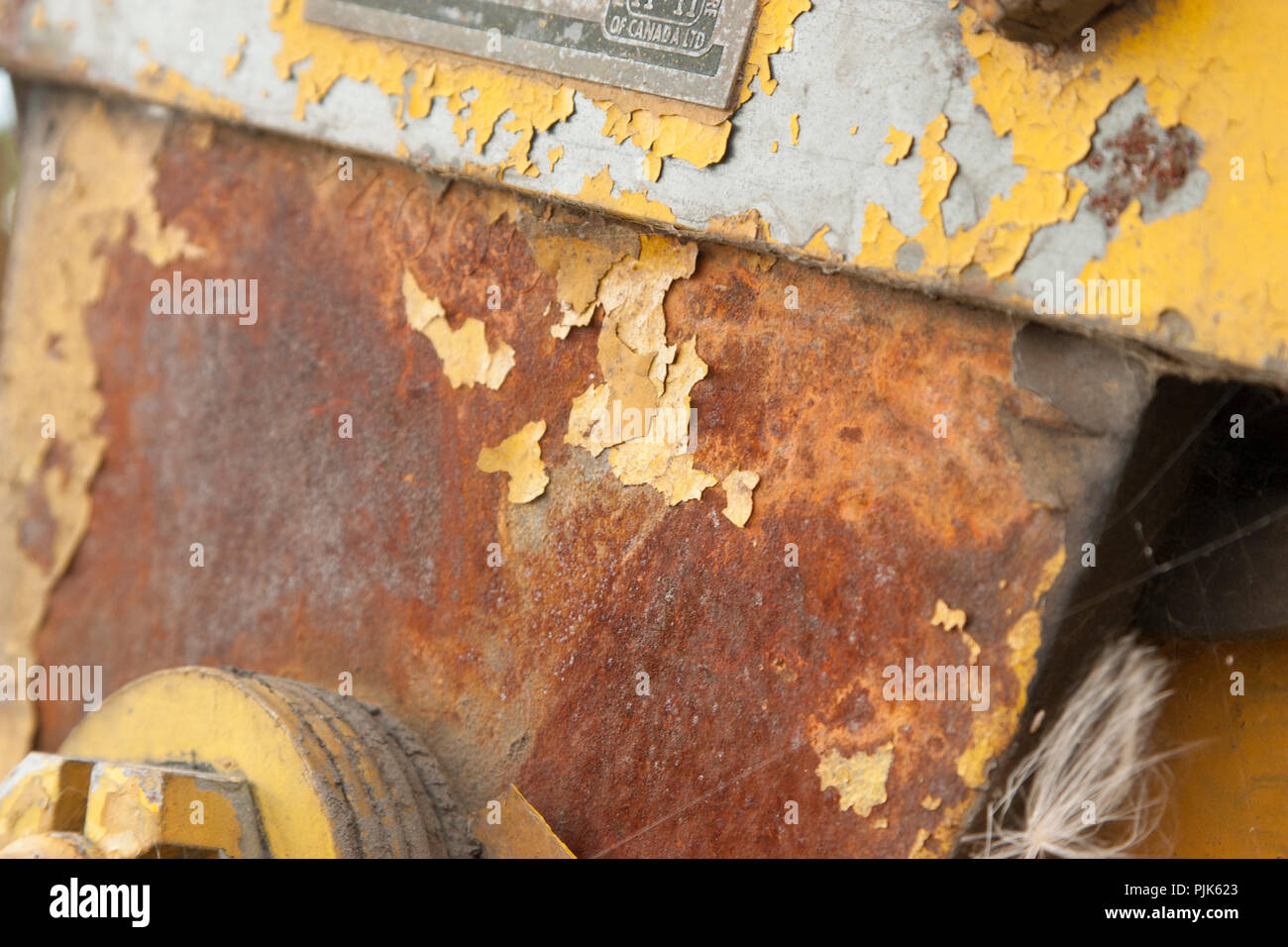 Rusted metal paint chips from decayed machinery. Close up of corrosion