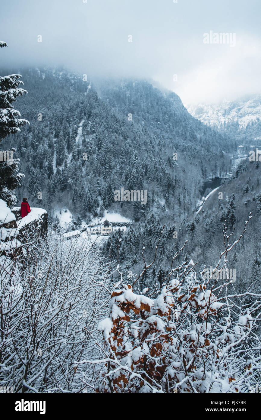 Germany, Bavaria, Berchtesgadener Land (district), person in red jacket at the ruins of Karlstein Castle Stock Photo