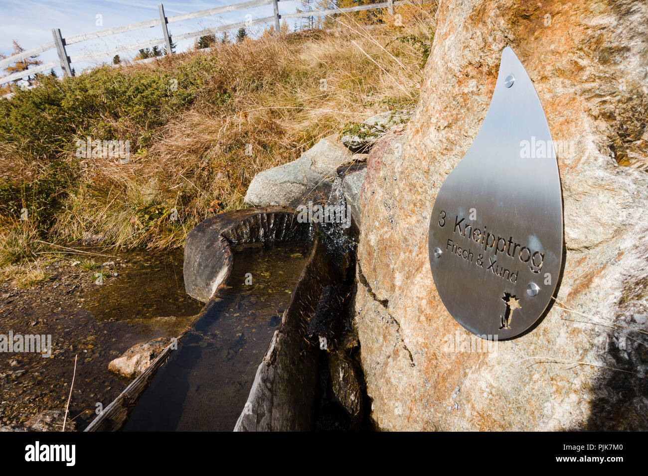 Trough filled with water for hydrotherapeutic use according to Sebastian Kneipp, Millstätter Berg Plateau, Obermillstatt, Lake Millstatt, Carinthia, Austria Stock Photo