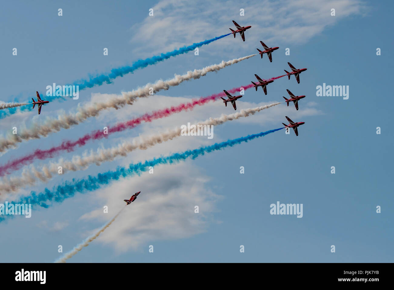 The RAF Red Arrows perform the Tornado manoeuvre during their afternoon display at Dunsfold Wings & Wheels, UK on the 25th August 2018. Stock Photo