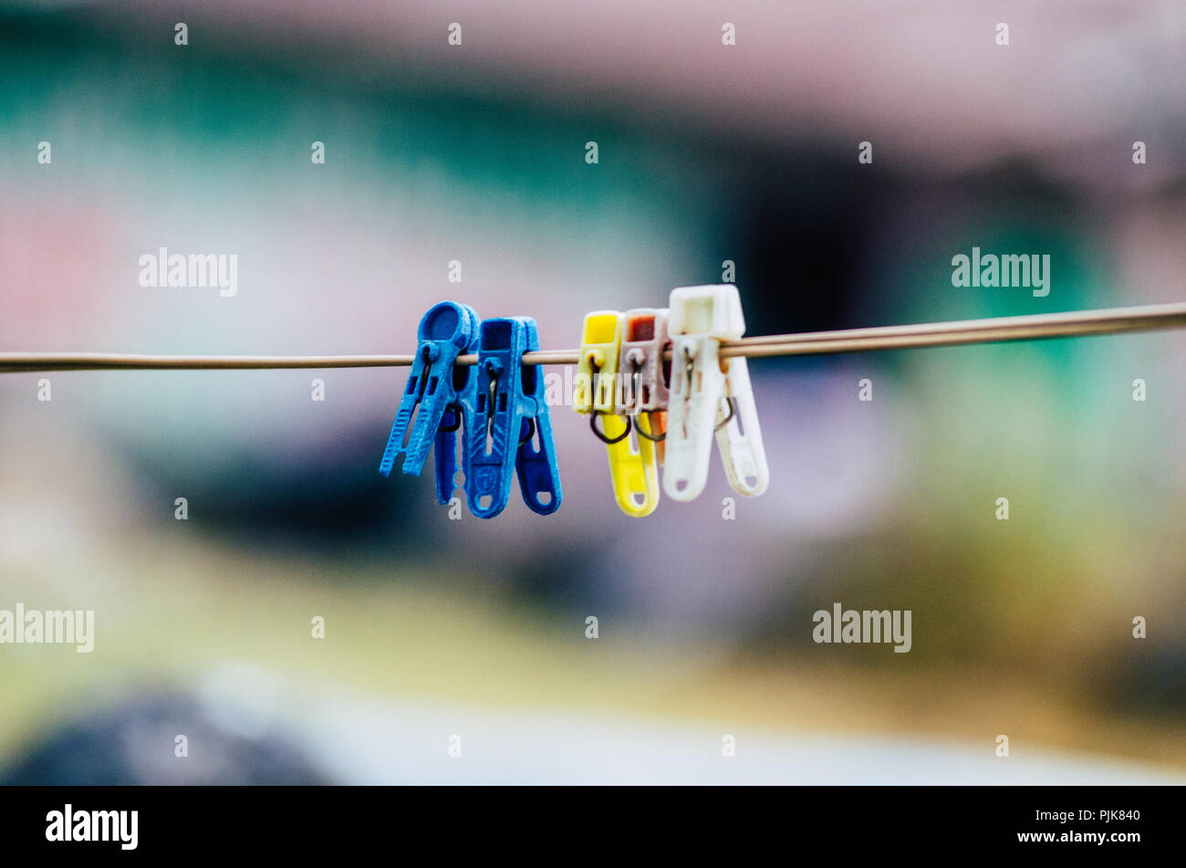 Plastic clothes pins, laundry hook, colorful, pegs ,outside ,hanged ,on the rope sunny clothing line Stock Photo