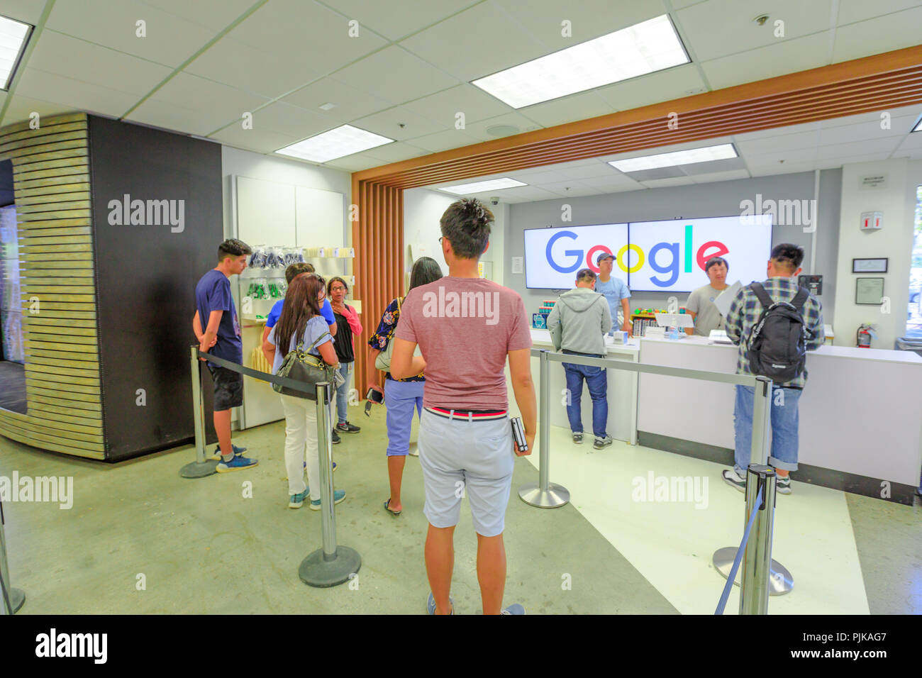 Mountain View, California, United States - August 13, 2018: interior of Merchandise Store of Google that sells T-shirts, hats, mugs and souvenirs with Google, YouTube, Android and branding. Stock Photo