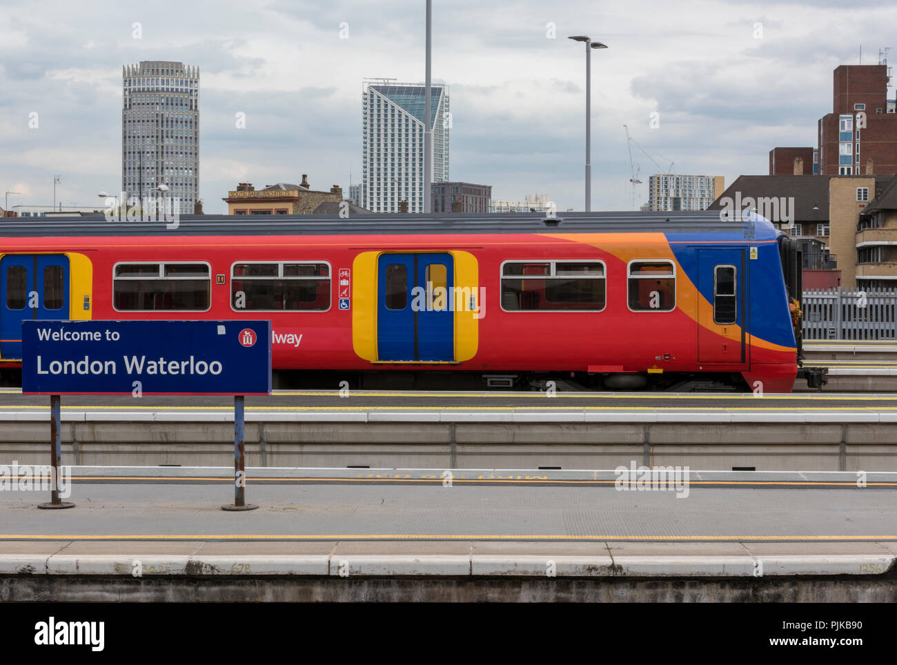 a southwestern railway suburban train service in the platform at london waterloo railway station Stock Photo