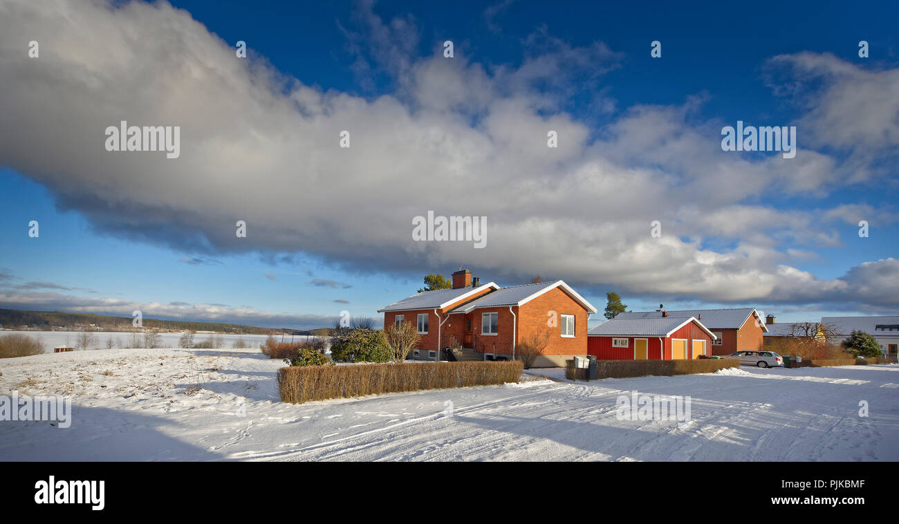 Idyllic snowcovered villas in the wintertime in Sweden Stock Photo