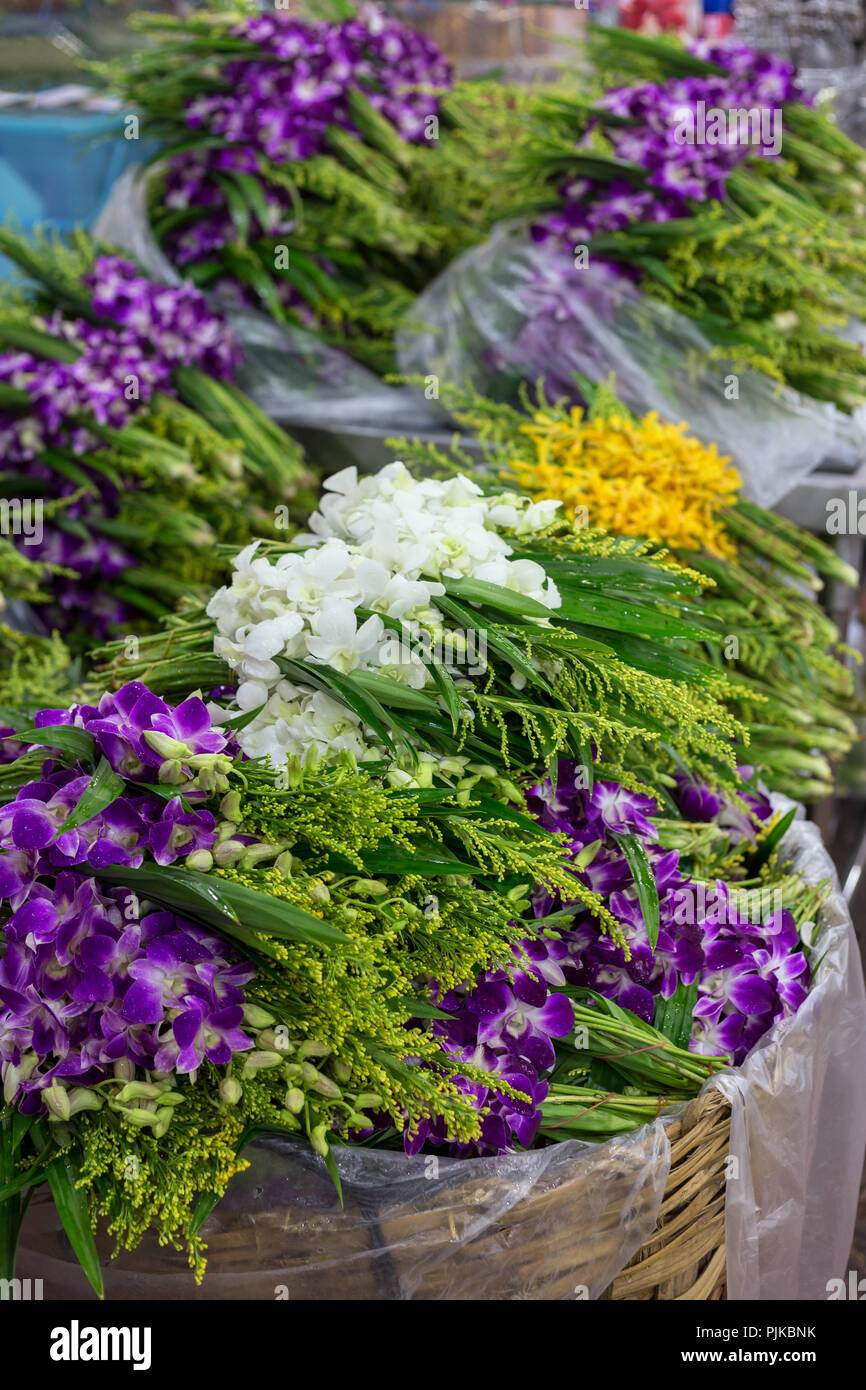 Stacks of fresh flowers for sale at the Yodpiman Flower Market (also