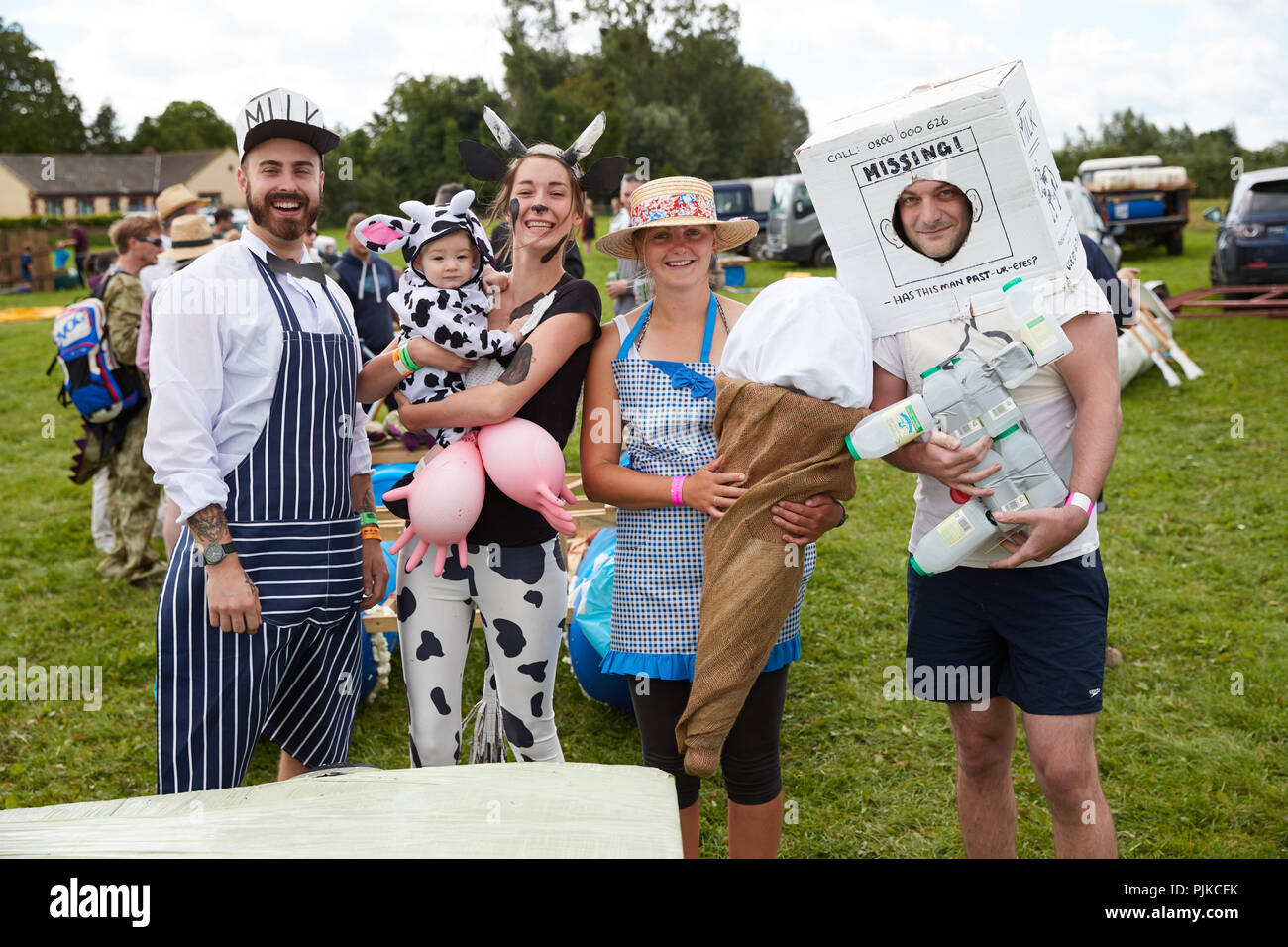 Group photo of people dressed in milk and cow related cotumes at the Lowland Games in Thorney Somerset England Stock Photo