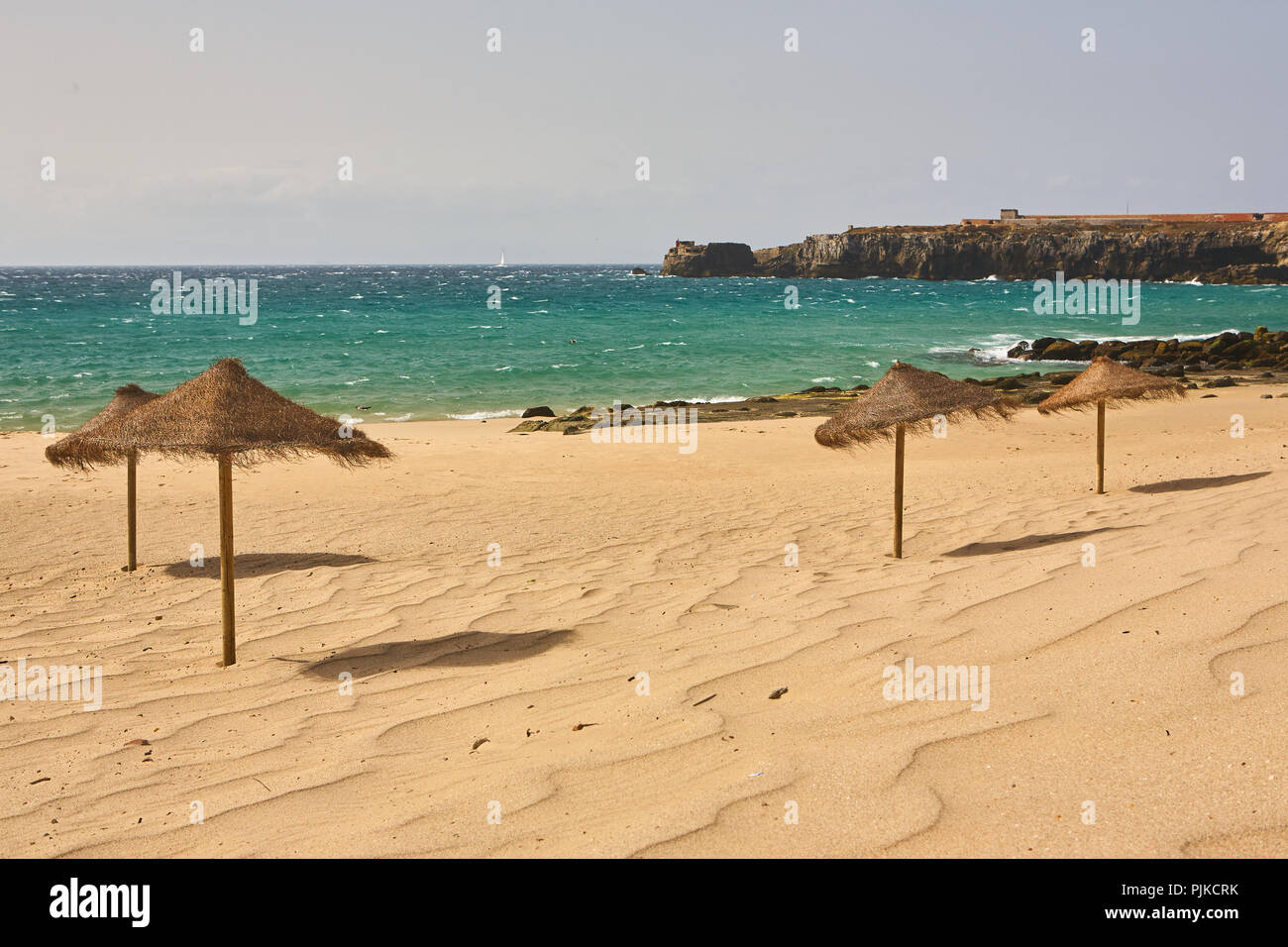 Straw Parasols On A Sunny Golden Beach In Tarifa Andalusia Spain Near Tangier In Morocco Stock Photo Alamy