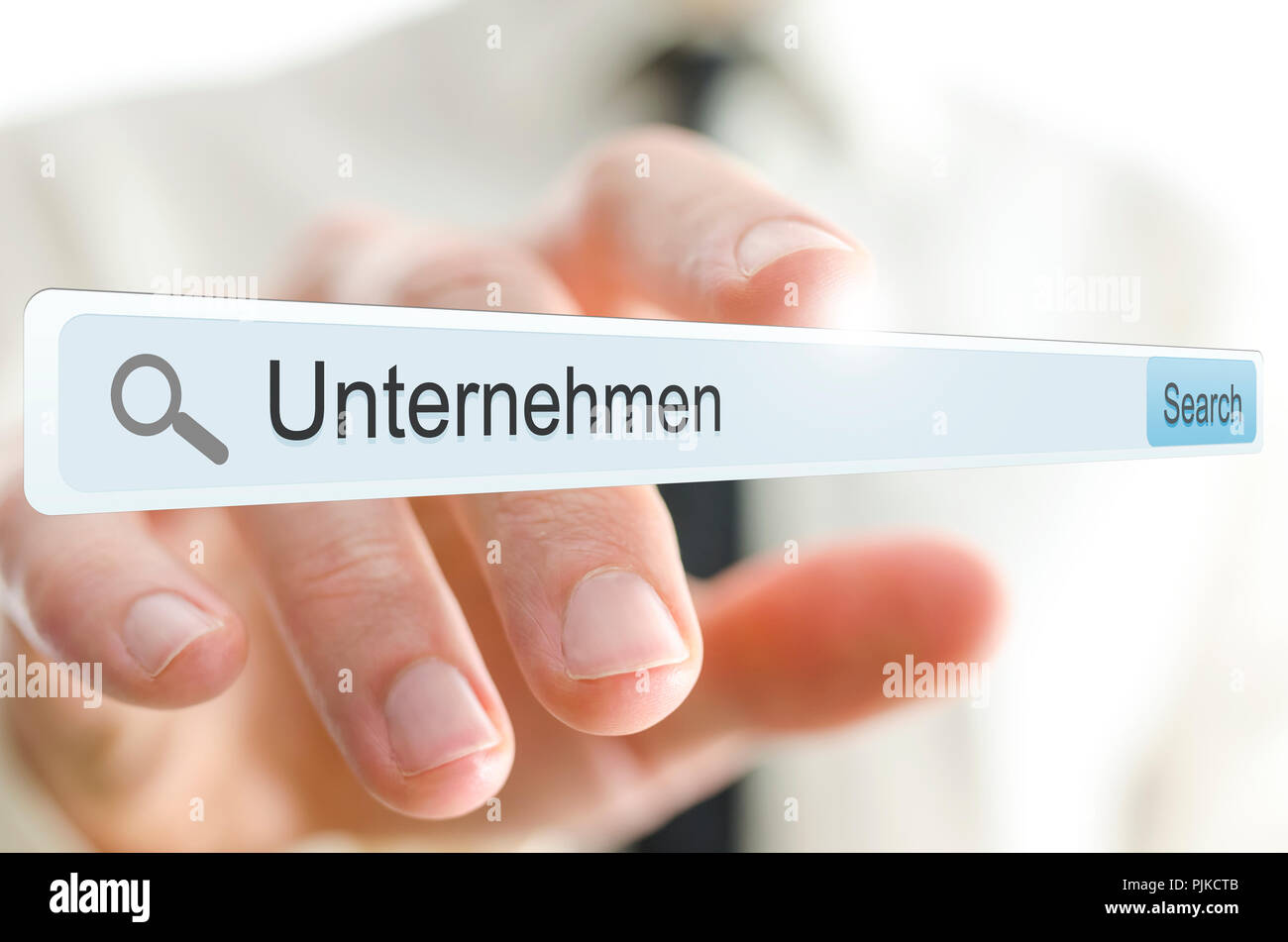 Word Unternehmen written in search bar on virtual screen. German for business. Stock Photo