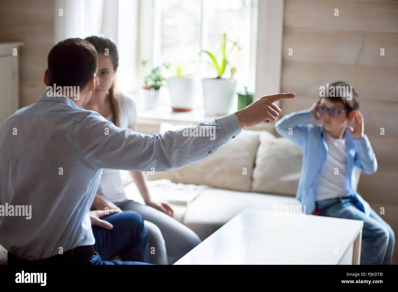 Parents having fight with presence of little kid Stock Photo