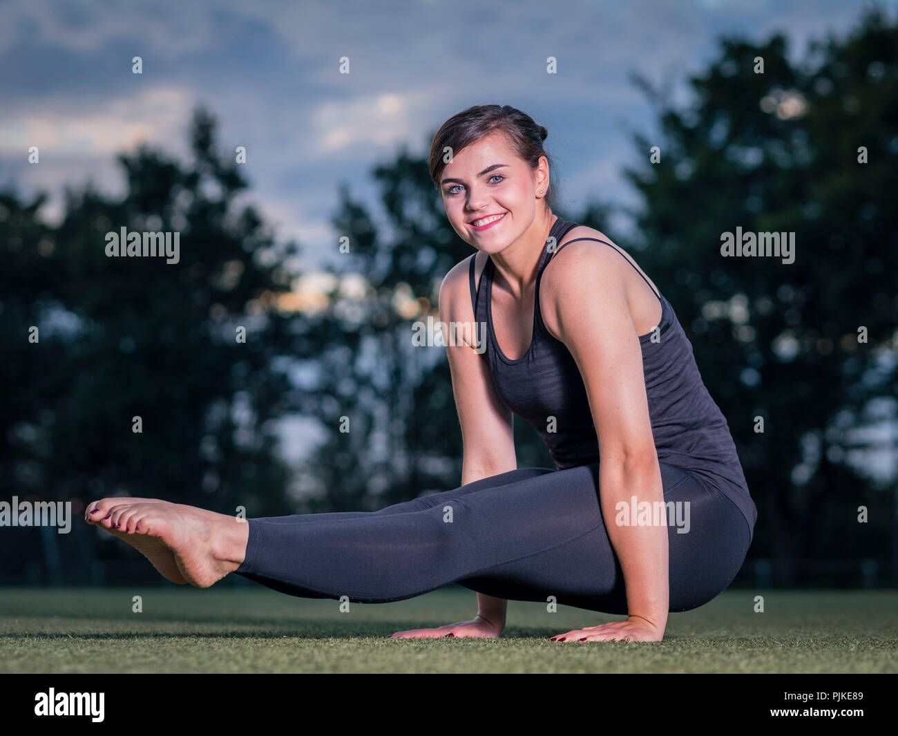 Woman, 25 years, acrobatic fitness training Stock Photo