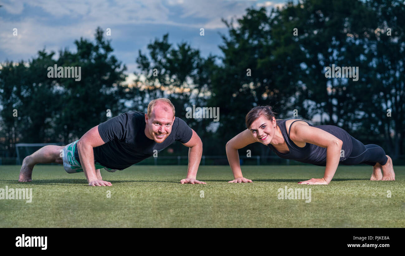 Personal fitness training, outdoor, man, 34 years, woman, 25 years Stock Photo