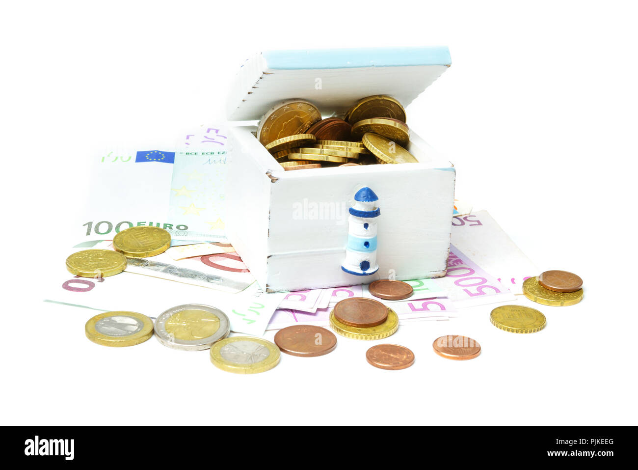 Holiday cash, Euro coins and notes in and under a wooden box Stock Photo