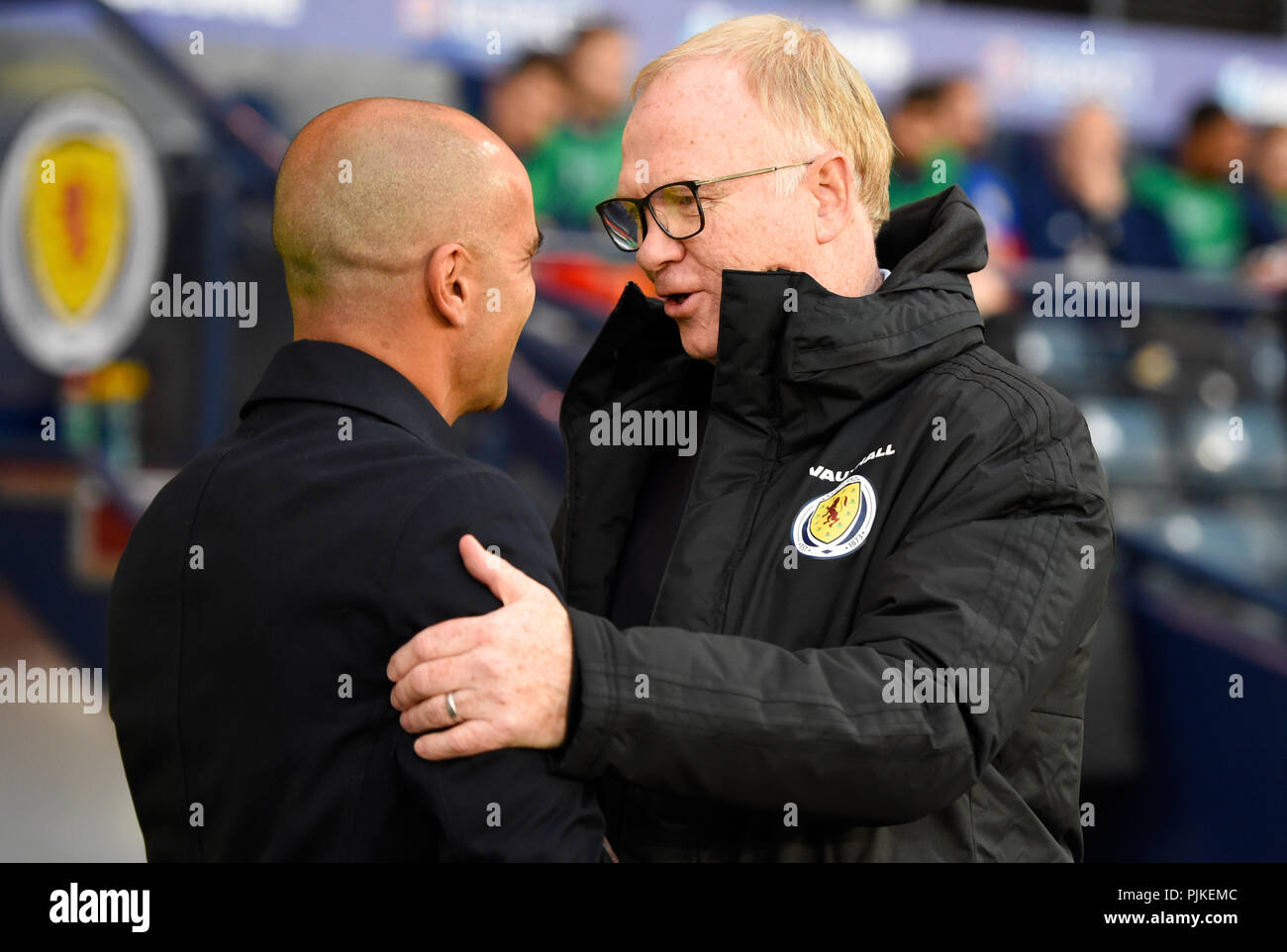 Belgium Manager Roberto Martinez (left) and Scotland Manager Alex McLeish shake hands ahead of the International Friendly at Hampden Park, Glasgow. Stock Photo