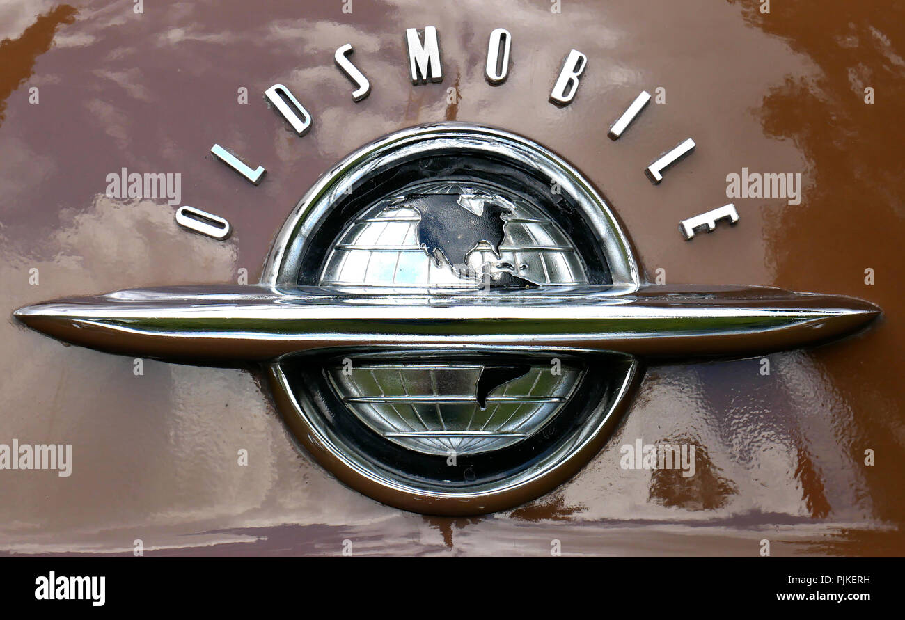 Details of american 50s cars during an exhibition in Medellín Colombia front of a brown oldsmobile World globe logo Stock Photo