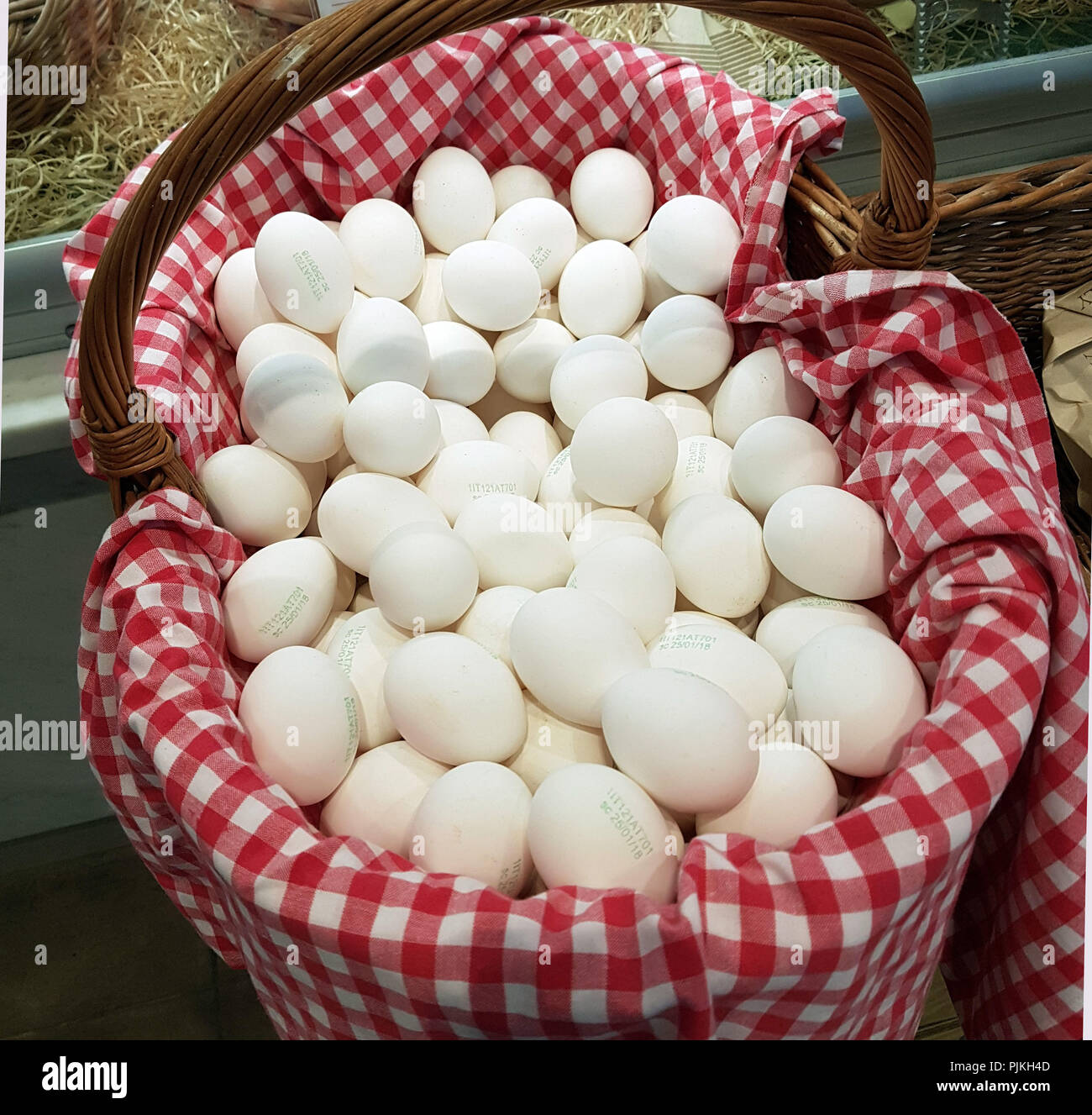 Free-range eggs in basket Stock Photo