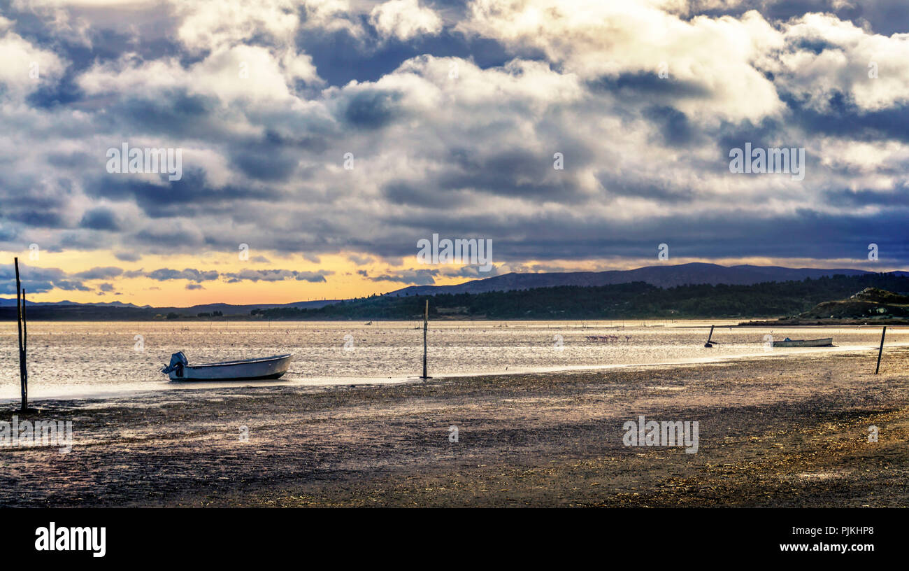 Fishing boats on the edge of the Étangs at Bage Stock Photo