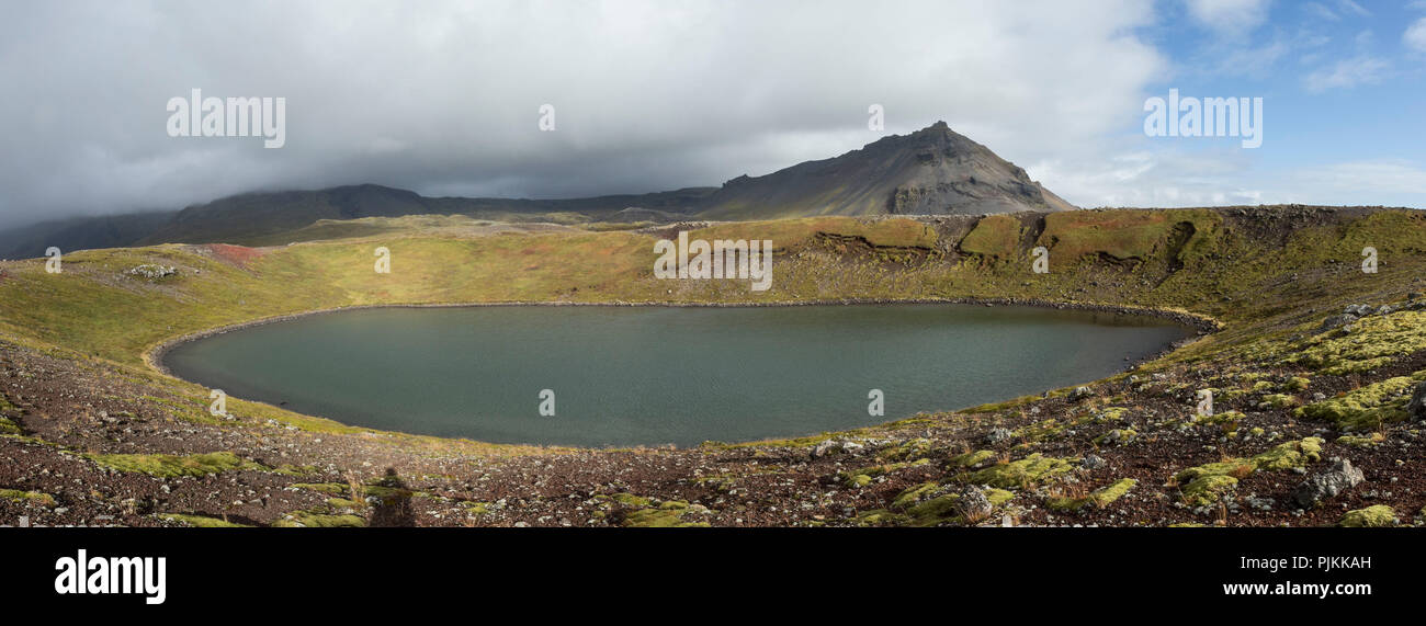 Iceland, Snaefellsnes, round crater lake, sunny, mountains in the background, Stock Photo