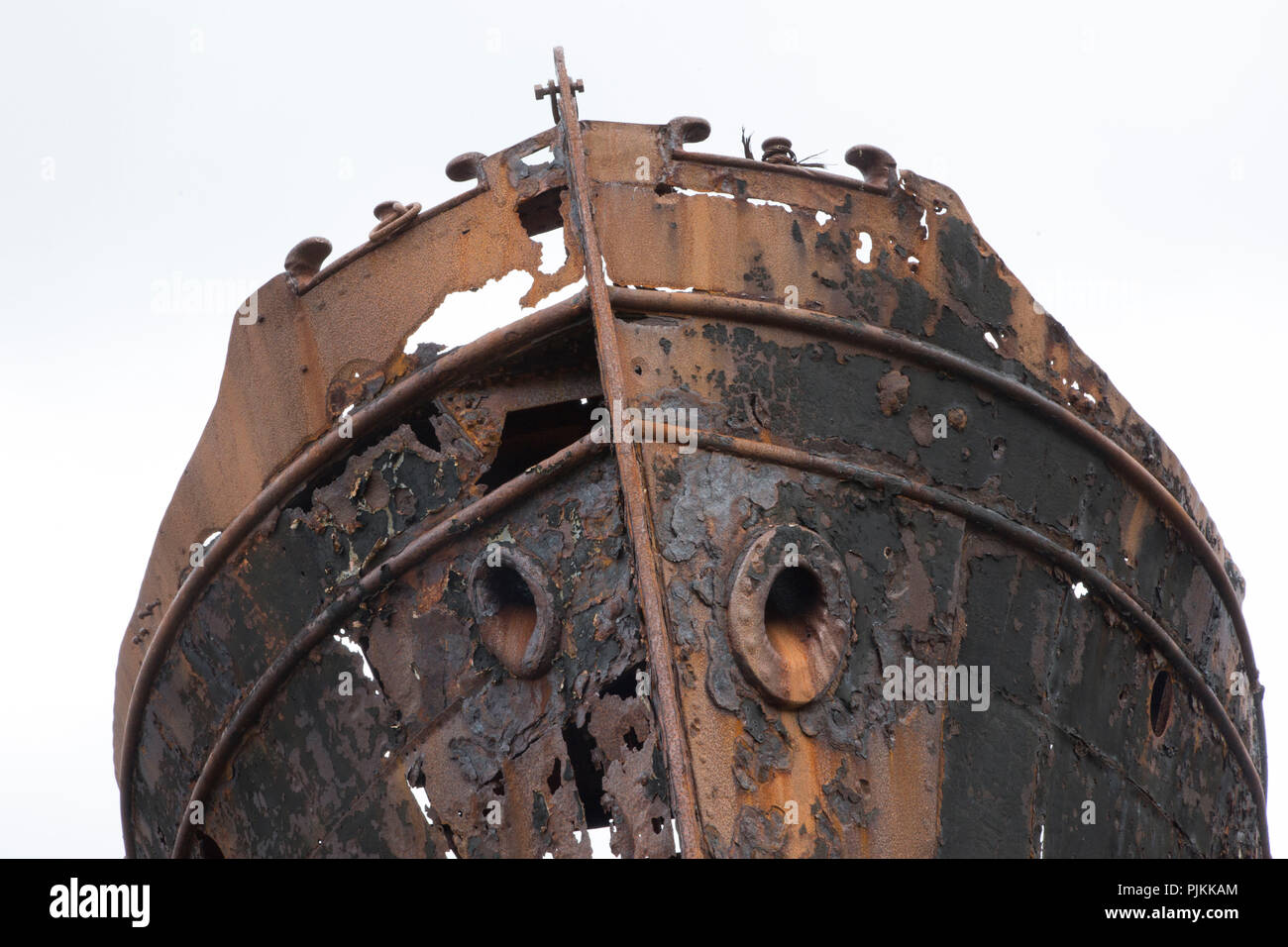Iceland, Djupavik, Westfjords, former herring factory, stranded ship, bow with anchor hawse holes, eaten away by the rust Stock Photo