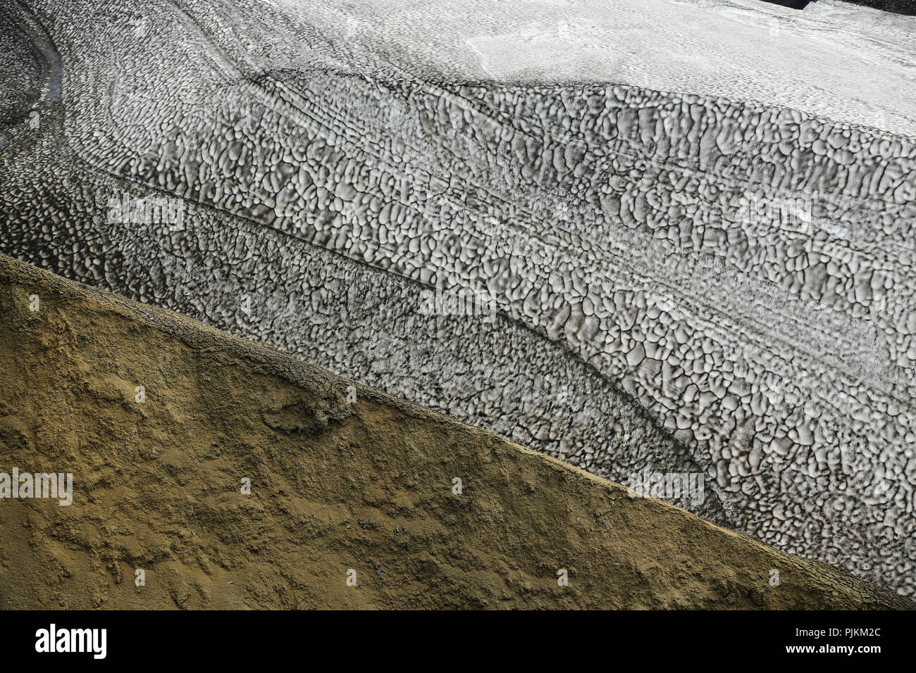Iceland, Fjallabak, snowfield, old snow covered with volcanic ash in ...