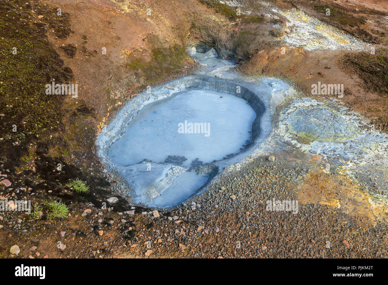 Iceland, high temperature zone, blue mud pot in brown soil, hot spring, Stock Photo